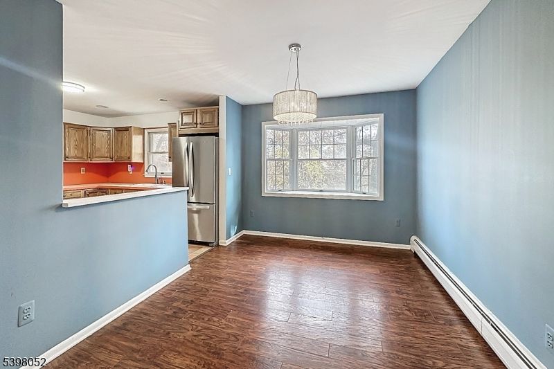 Chandelier, Empty room, Interior, Kitchen, Stainless Steel Appliances, Wood Texture Flooring