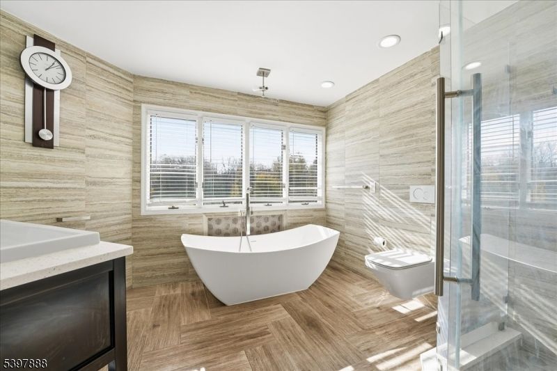 Bathroom, Free Standing Baths, Glass Shower, Interior, Recessed Lighting, Wood Texture Flooring, Wooden Walls