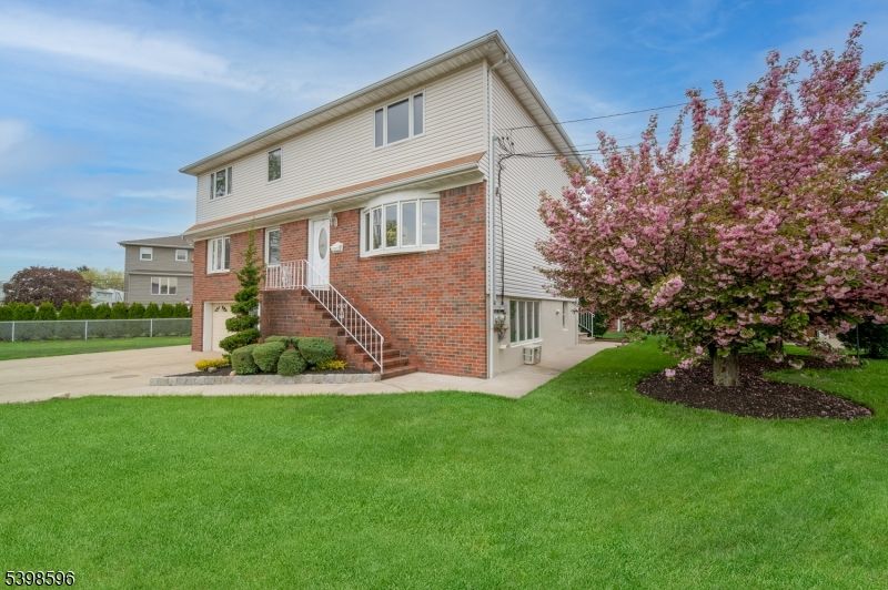 Attached, Backyard, Exterior, Facade, Brick Facade, Split Level