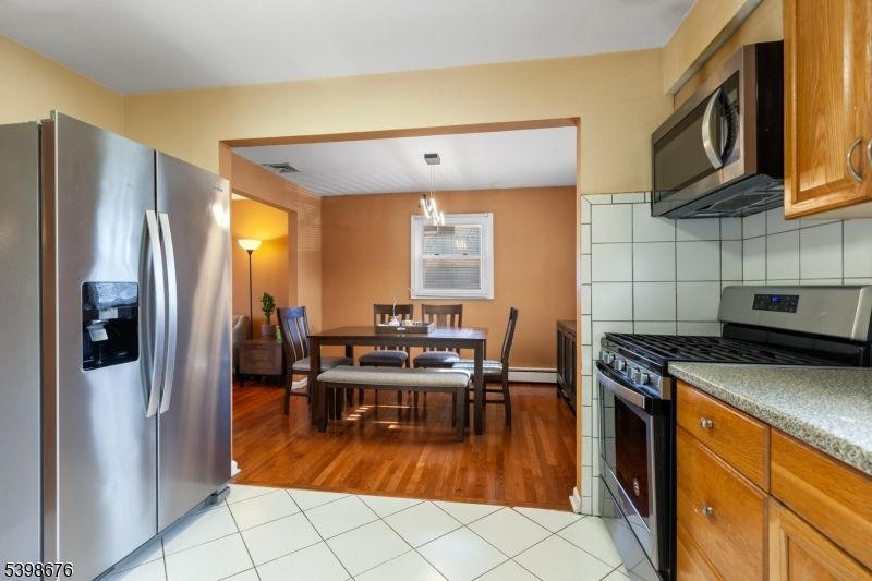 Dining room, Interior, Kitchen, Pendant Lights, Stainless Steel Appliances, Wood Texture Flooring