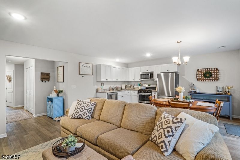 Chandelier, Dining room, Interior, Kitchen, Living room, Recessed Lighting, Stainless Steel Appliances, Wood Texture Flooring