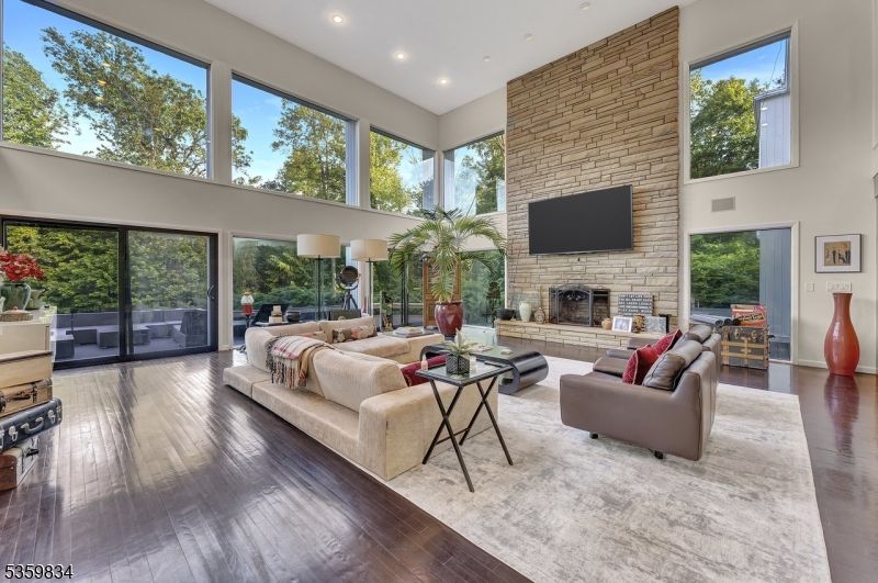 Fireplace, Interior, Living room, Recessed Lighting, Stone Walls, Wood Texture Flooring