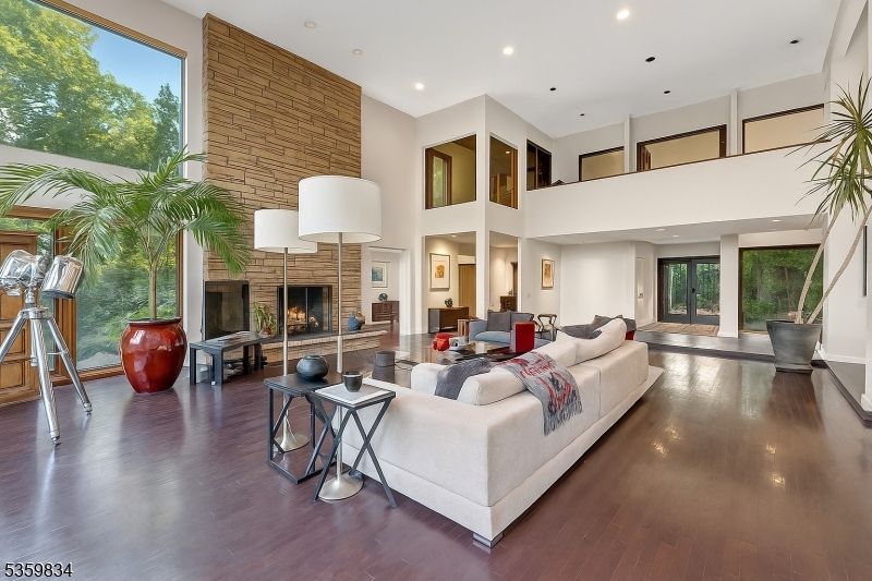 Fireplace, Interior, Living room, Recessed Lighting, Stone Walls, Wood Texture Flooring