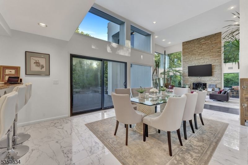 Dining room, Fireplace, Interior, Living room, Marble, Recessed Lighting, Stone Walls