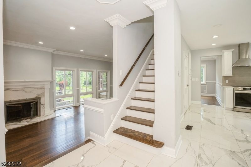 Fireplace, Interior, Kitchen, Marble, Recessed Lighting, Stainless Steel Appliances, Wood Texture Flooring