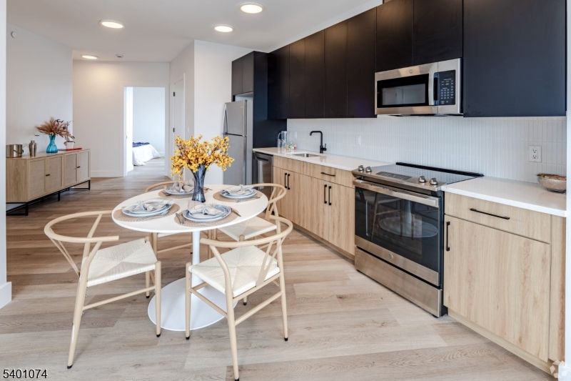 Interior, Kitchen, Recessed Lighting, Stainless Steel Appliances, Wood Texture Flooring