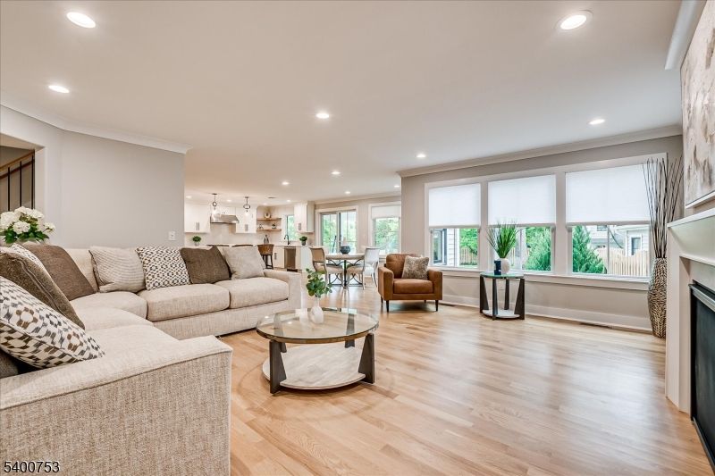 Dining room, Fireplace, Interior, Living room, Pendant Lights, Recessed Lighting, Wood Texture Flooring