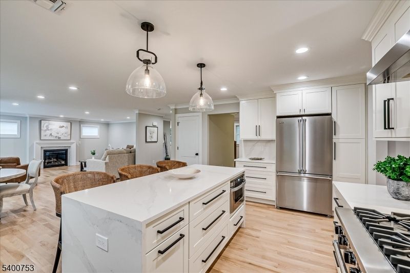 Dining room, Fireplace, Interior, Kitchen, Living room, Pendant Lights, Recessed Lighting, Stainless Steel Appliances, Wood Texture Flooring