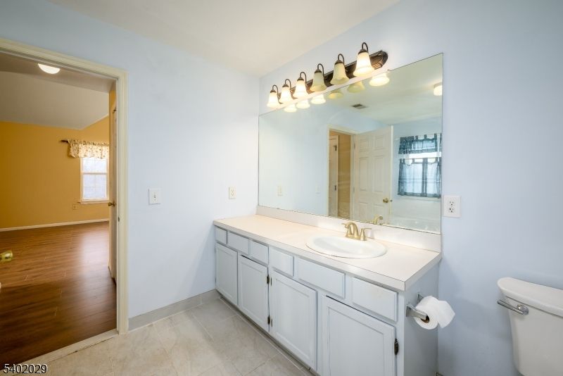 Bathroom, Dual Sink Vanities, Interior, Tile Countertops, Wood Texture Flooring