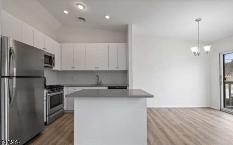 Chandelier, Interior, Kitchen, Pendant Lights, Recessed Lighting, Stainless Steel Appliances, Wood Texture Flooring