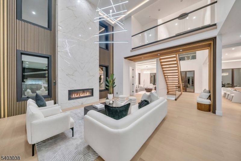 Fireplace, Interior, Living room, Marble Walls, Pendant Lights, Recessed Lighting, Wood Texture Flooring