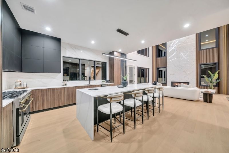 Fireplace, Interior, Kitchen, Living room, Marble Walls, Pendant Lights, Recessed Lighting, Stainless Steel Appliances, Wood Texture Flooring