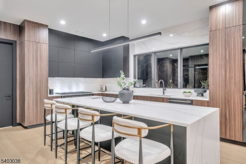 Interior, Kitchen, Marble Walls, Pendant Lights, Recessed Lighting, Stainless Steel Appliances, Wood Texture Flooring