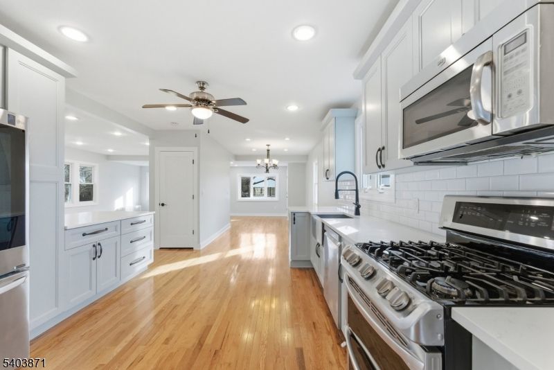 Chandelier, Interior, Kitchen, Recessed Lighting, Stainless Steel Appliances, Wood Texture Flooring