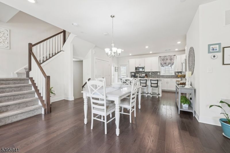 Chandelier, Dining room, Interior, Kitchen, Recessed Lighting, Stainless Steel Appliances, Wood Texture Flooring