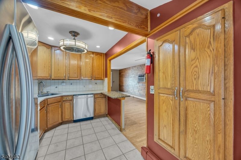 Interior, Kitchen, Recessed Lighting, Stainless Steel Appliances, Stone Walls, Wood Texture Flooring