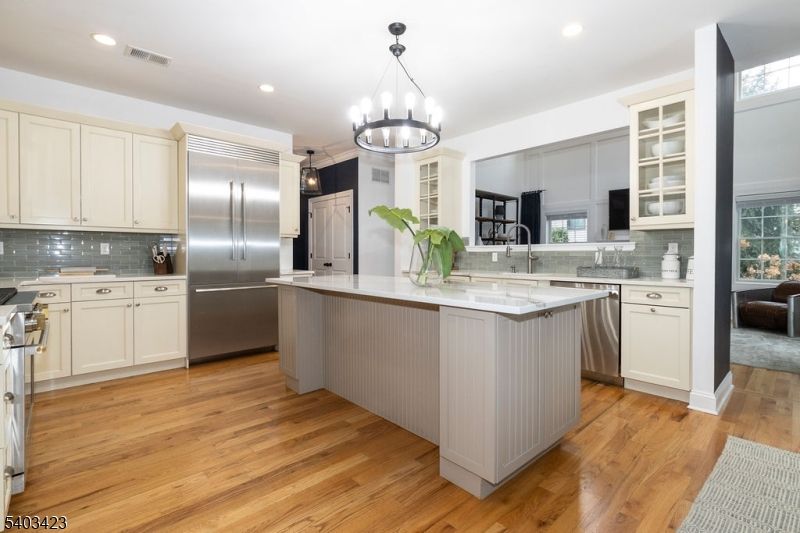 Chandelier, Interior, Kitchen, Pendant Lights, Recessed Lighting, Stainless Steel Appliances, Wood Texture Flooring