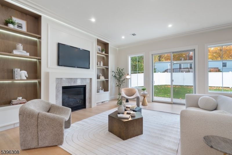 Fireplace, Interior, Living room, Recessed Lighting, Water, Wood Texture Flooring