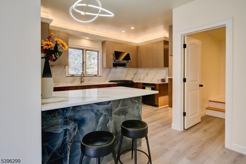 Interior, Kitchen, Marble Walls, Pendant Lights, Recessed Lighting, Wood Texture Flooring