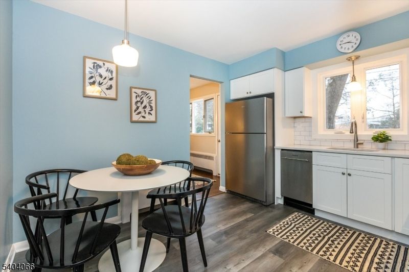 Dining room, Interior, Kitchen, Pendant Lights, Stainless Steel Appliances, Wood Texture Flooring