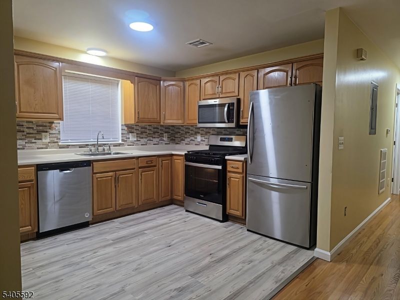 Interior, Kitchen, Recessed Lighting, Stainless Steel Appliances, Wood Texture Flooring