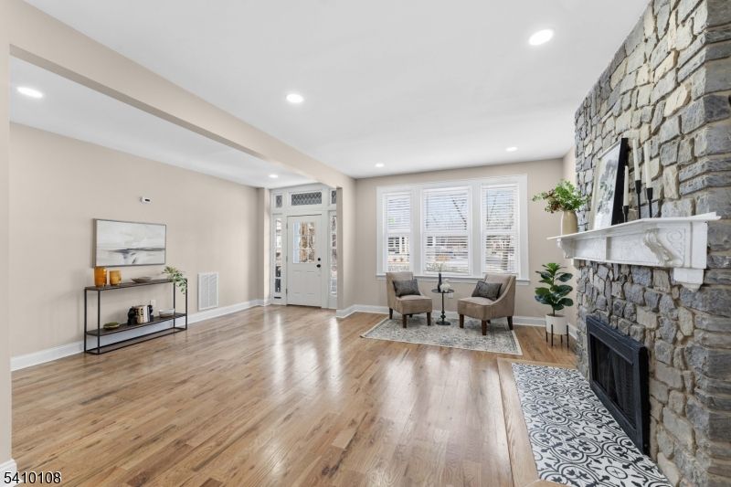 Dining room, Fireplace, Interior, Recessed Lighting, Stone Walls, Wood Texture Flooring
