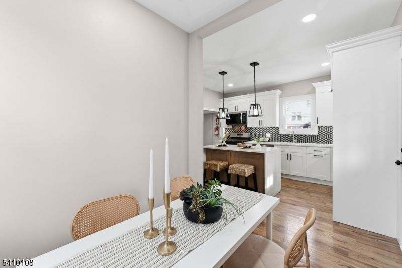 Dining room, Interior, Kitchen, Pendant Lights, Recessed Lighting, Stainless Steel Appliances, Wood Texture Flooring