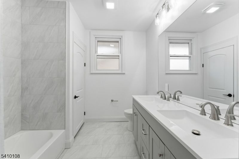 Bathroom, Dual Sink Vanities, Interior, Marble, Marble Walls, Recessed Lighting