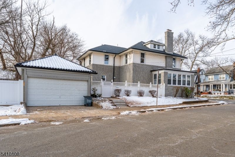 Attached, Exterior, Facade, Brick Facade, American Foursquare