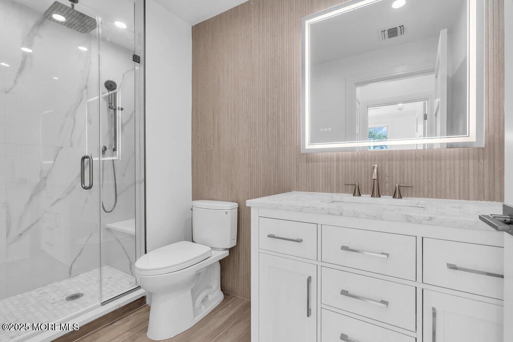 Bathroom, Glass Shower, Interior, Marble Walls, Recessed Lighting, Wood Texture Flooring