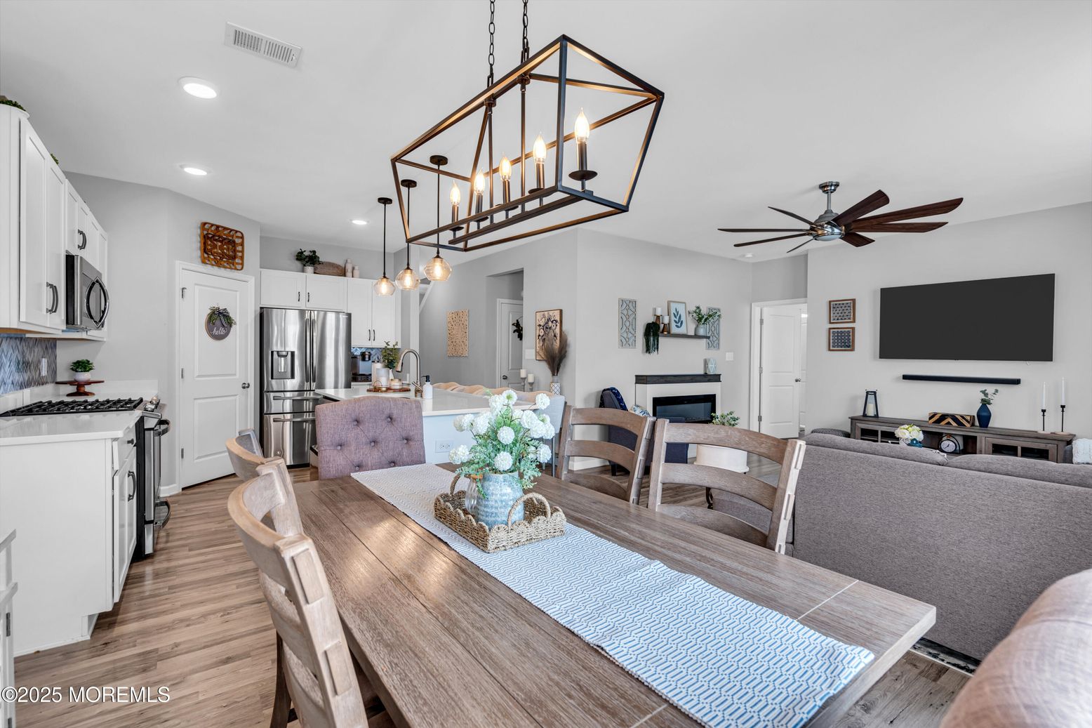 Dining room, Fireplace, Interior, Kitchen, Pendant Lights, Recessed Lighting, Stainless Steel Appliances, Wood Texture Flooring