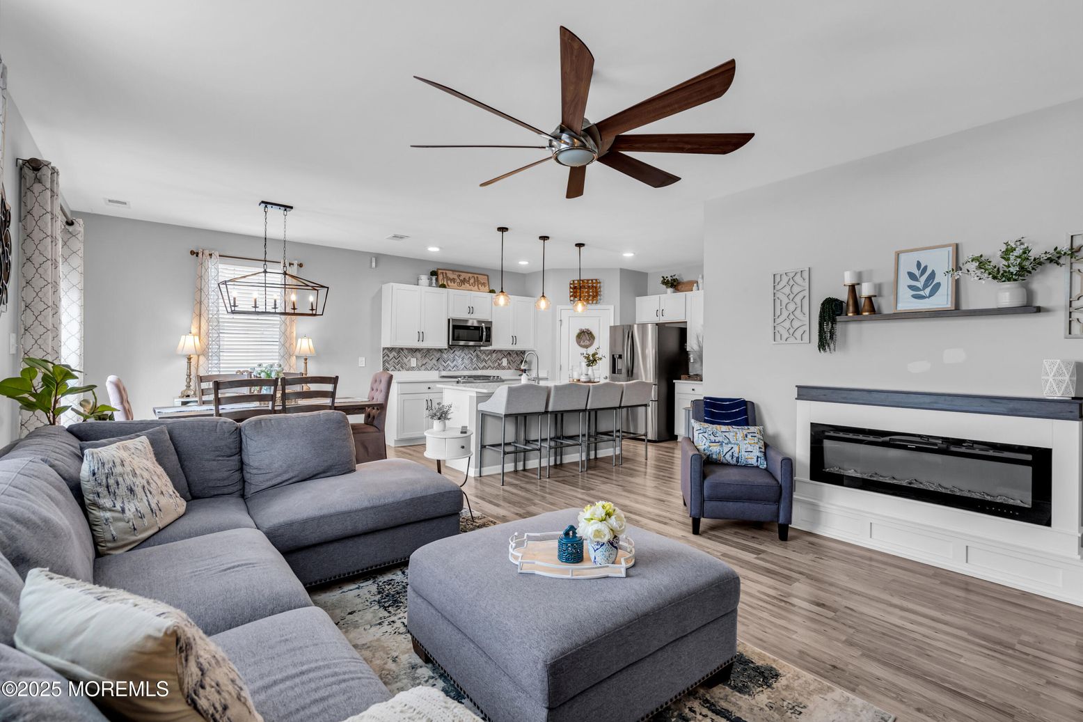 Dining room, Fireplace, Interior, Kitchen, Living room, Pendant Lights, Recessed Lighting, Stainless Steel Appliances, Wood Texture Flooring