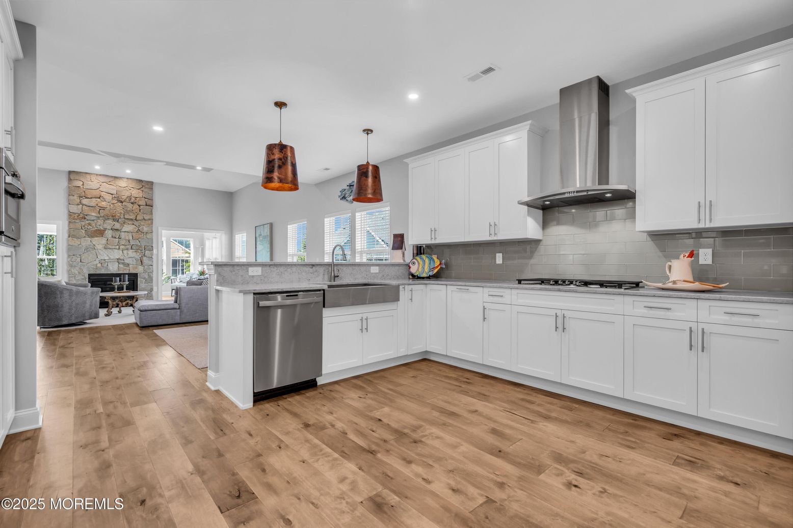Fireplace, Interior, Kitchen, Living room, Pendant Lights, Recessed Lighting, Stainless Steel Appliances, Stone Walls, Wood Texture Flooring