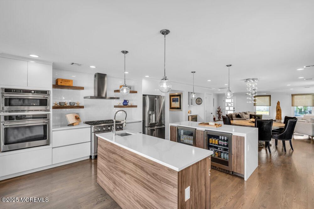 Dining room, Interior, Kitchen, Pendant Lights, Recessed Lighting, Stainless Steel Appliances, Wood Texture Flooring