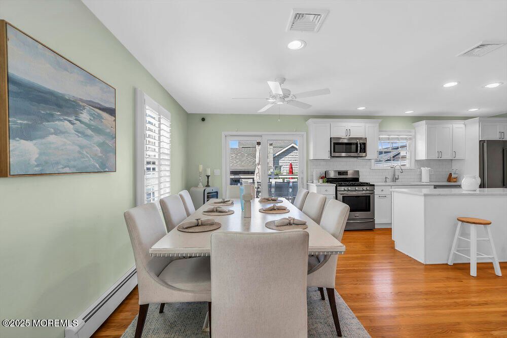 Dining room, Interior, Kitchen, Recessed Lighting, Stainless Steel Appliances, Wood Texture Flooring