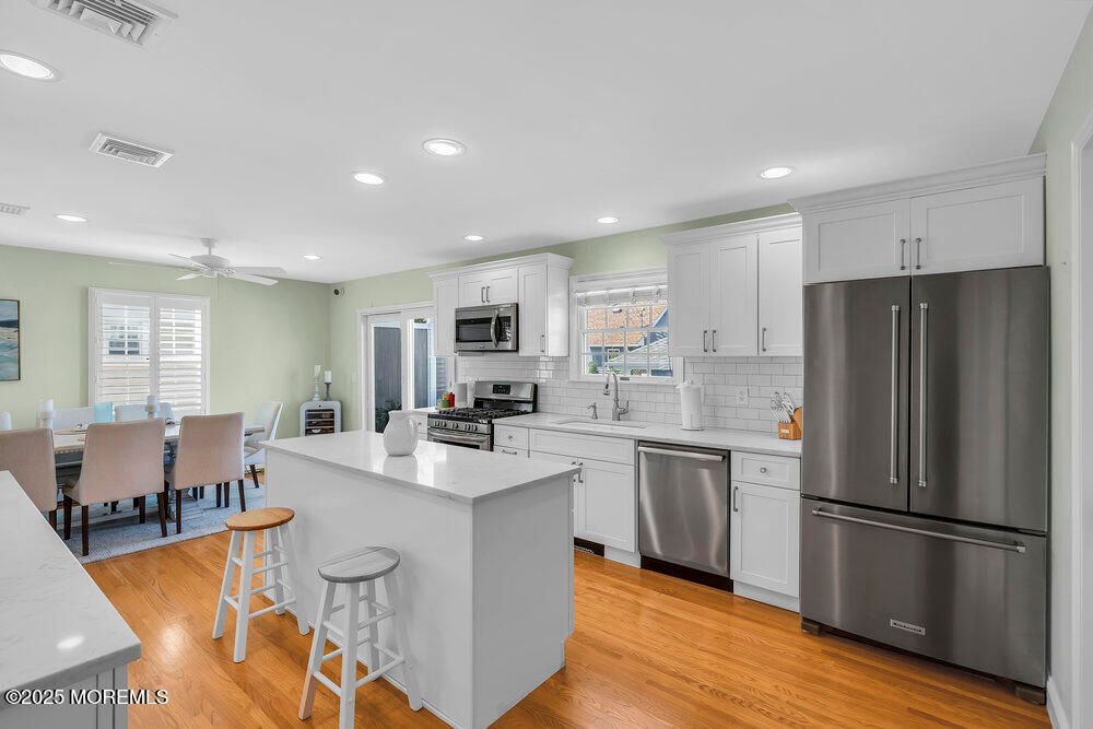 Dining room, Interior, Kitchen, Recessed Lighting, Stainless Steel Appliances, Wood Texture Flooring