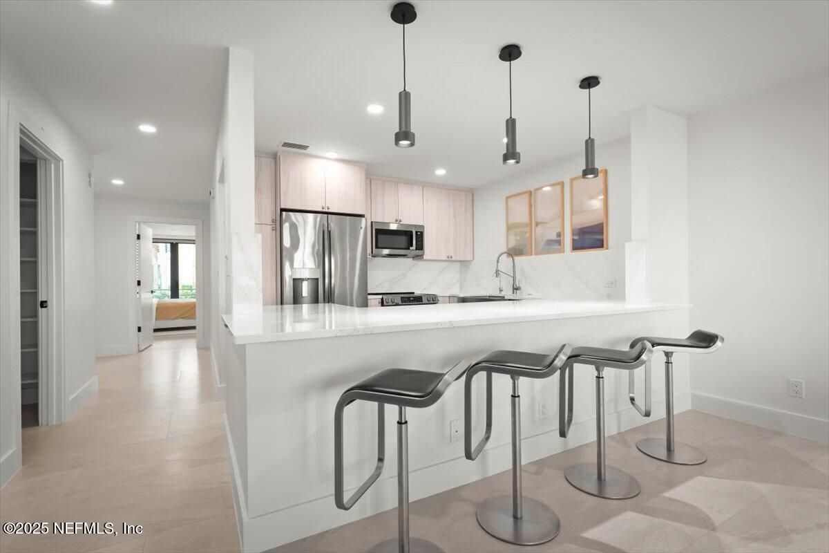 Interior, Kitchen, Marble Walls, Pendant Lights, Recessed Lighting, Stainless Steel Appliances