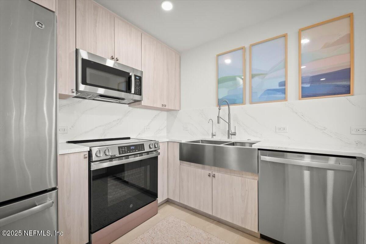 Interior, Kitchen, Marble Walls, Recessed Lighting, Stainless Steel Appliances