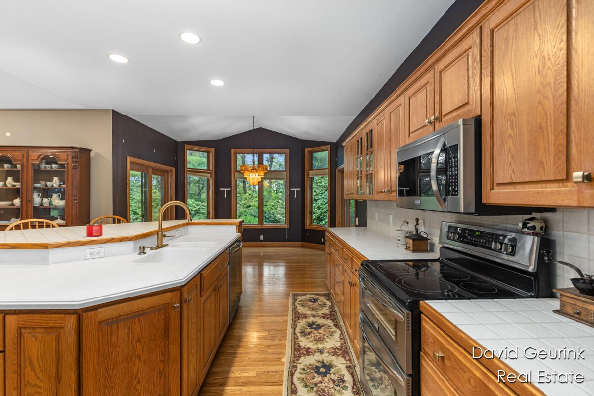 Interior, Kitchen, Recessed Lighting, Tile Countertops, Wood Texture Flooring