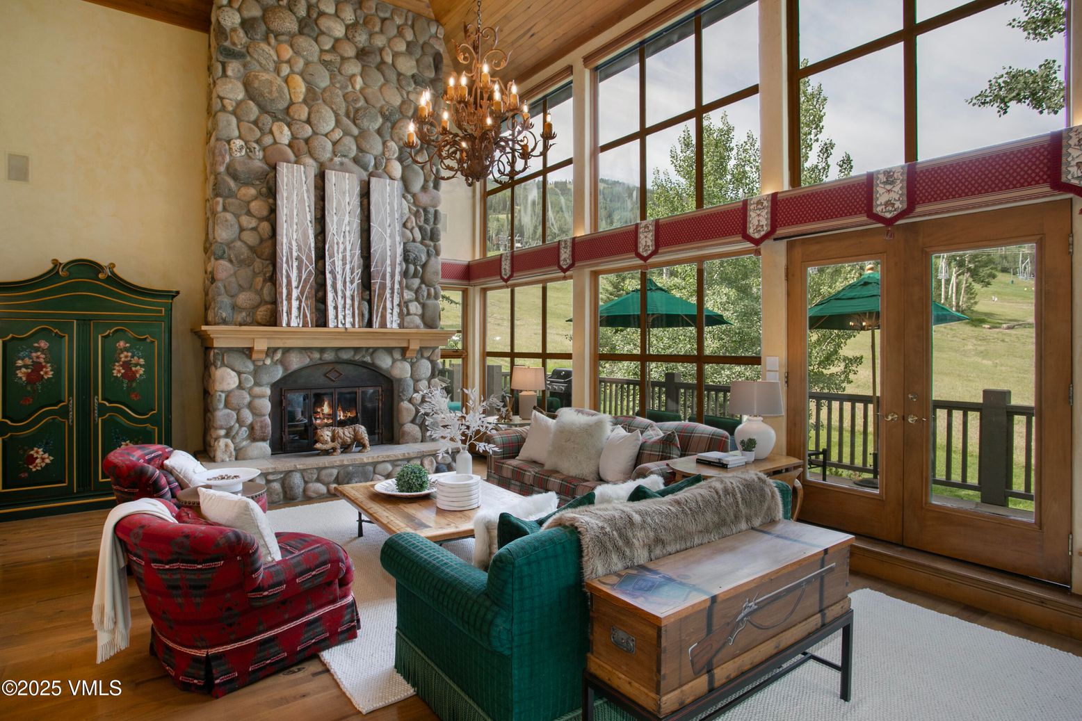 Chandelier, Fireplace, Interior, Living room, Stone Walls, Sun Room, Wood Texture Flooring