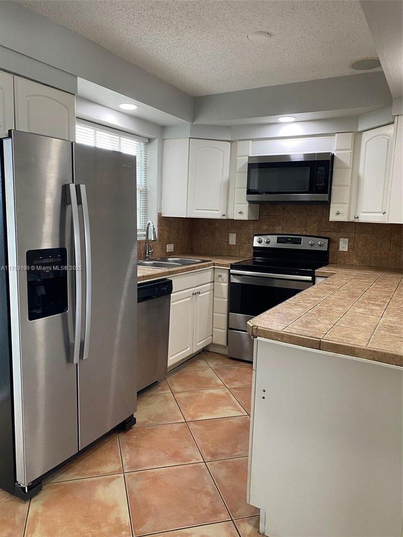 Interior, Kitchen, Stainless Steel Appliances, Tile Countertops