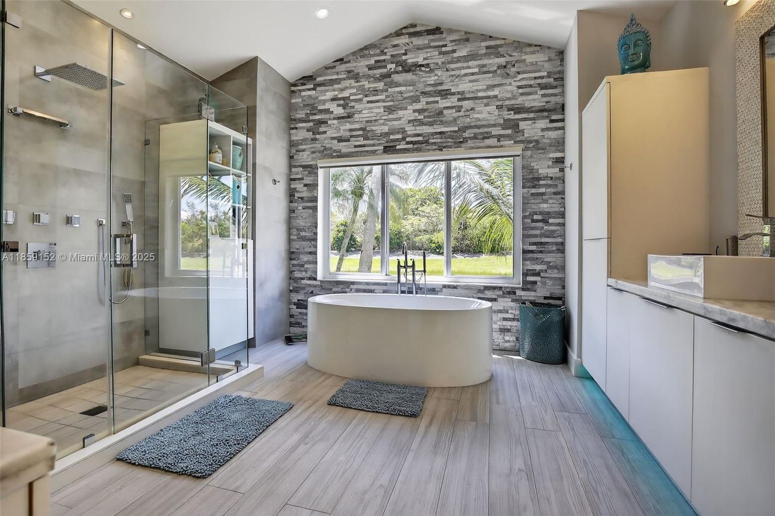 Bathroom, Free Standing Baths, Glass Shower, Interior, Recessed Lighting, Stone Walls, Wood Texture Flooring