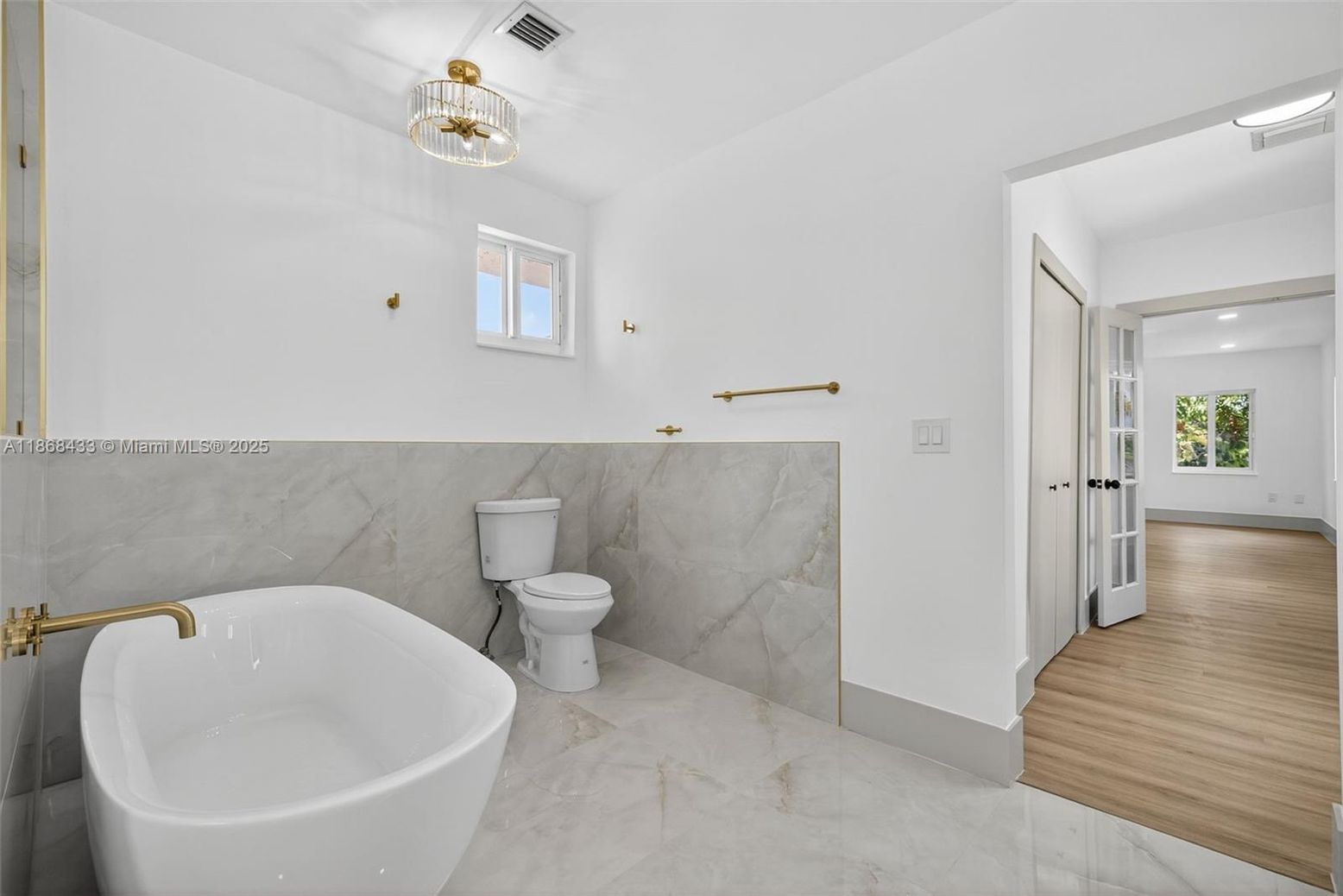 Bathroom, Free Standing Baths, Interior, Marble, Marble Walls, Recessed Lighting, Wood Texture Flooring
