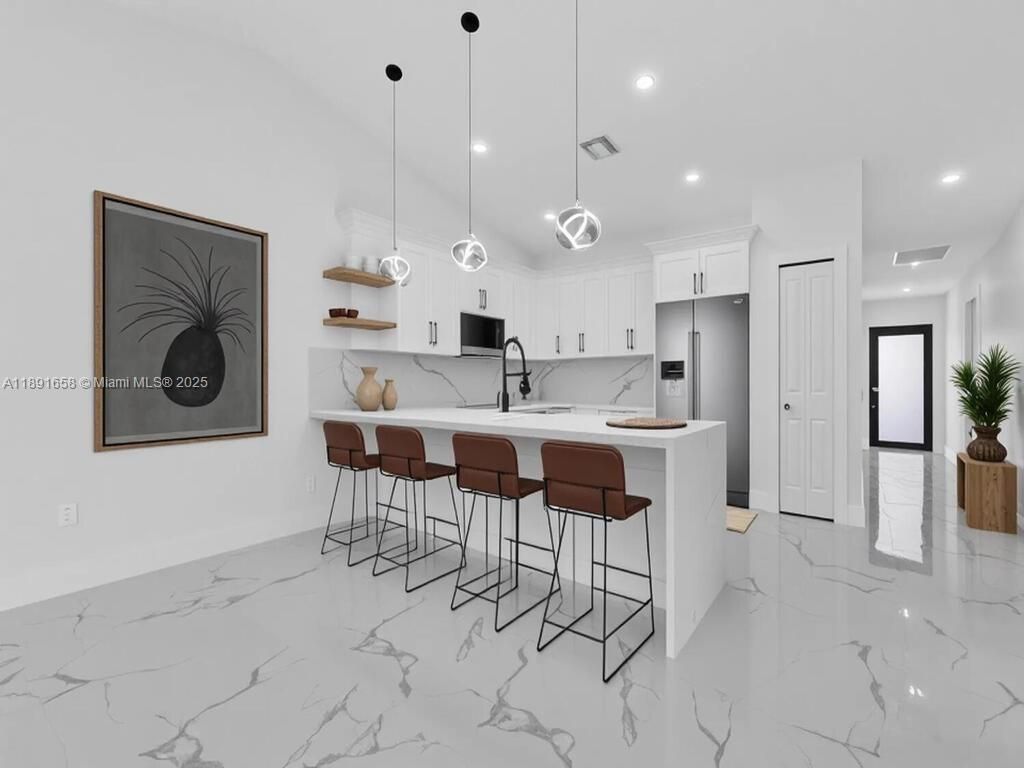 Interior, Kitchen, Marble, Marble Walls, Pendant Lights, Recessed Lighting, Stainless Steel Appliances