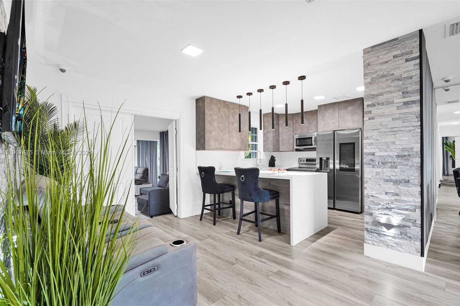 Interior, Kitchen, Pendant Lights, Recessed Lighting, Stainless Steel Appliances, Stone Walls, Wood Texture Flooring