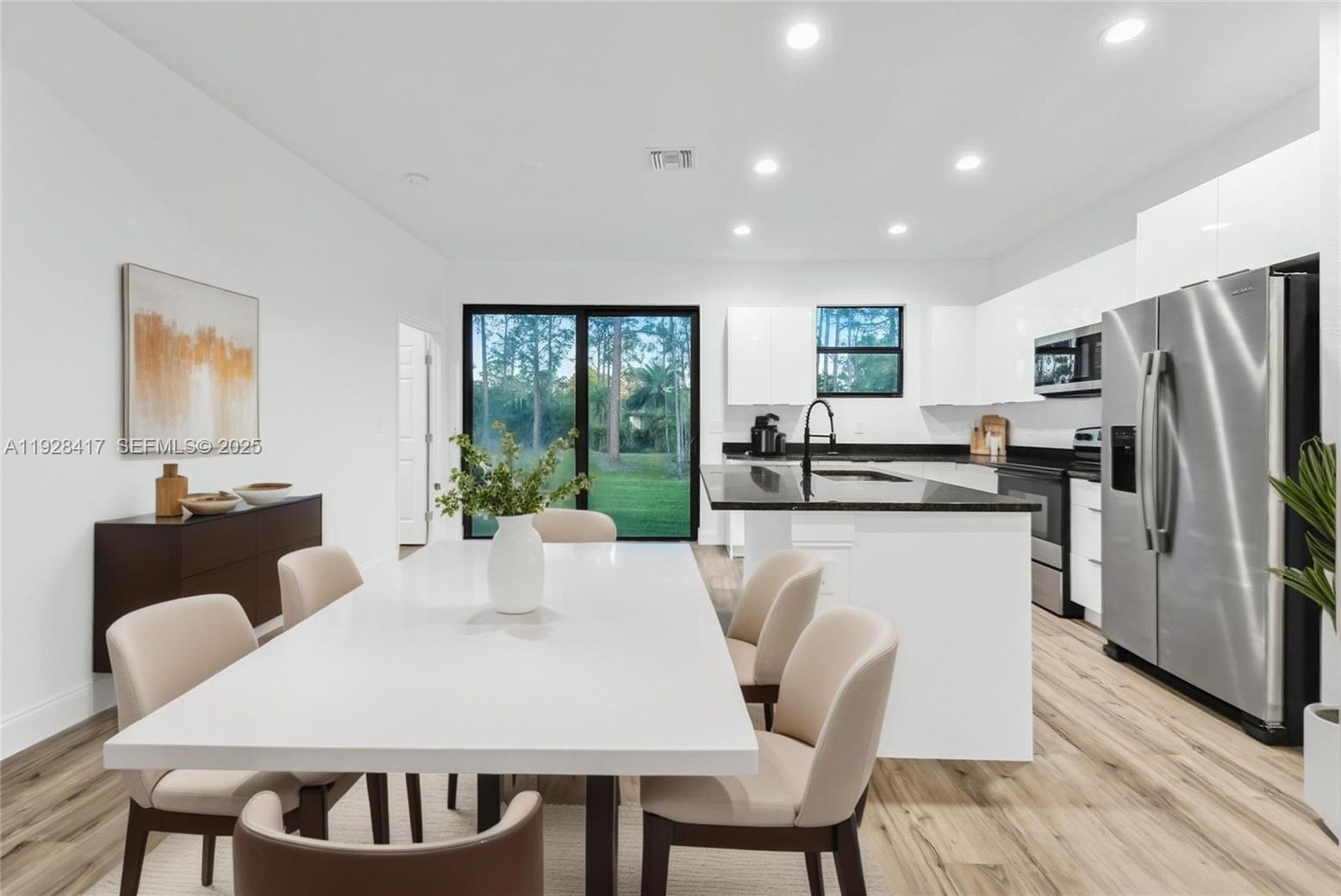 Dining room, Interior, Kitchen, Recessed Lighting, Stainless Steel Appliances, Wood Texture Flooring