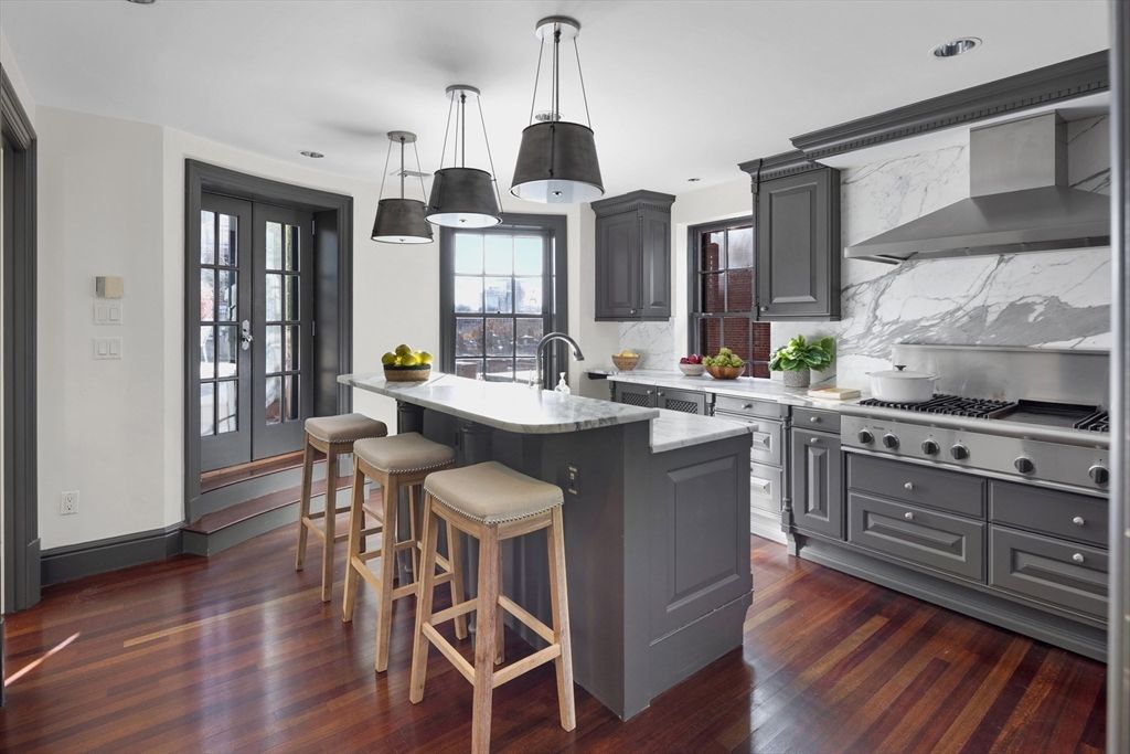 Interior, Kitchen, Marble Walls, Pendant Lights, Recessed Lighting, Stainless Steel Appliances, Wood Texture Flooring