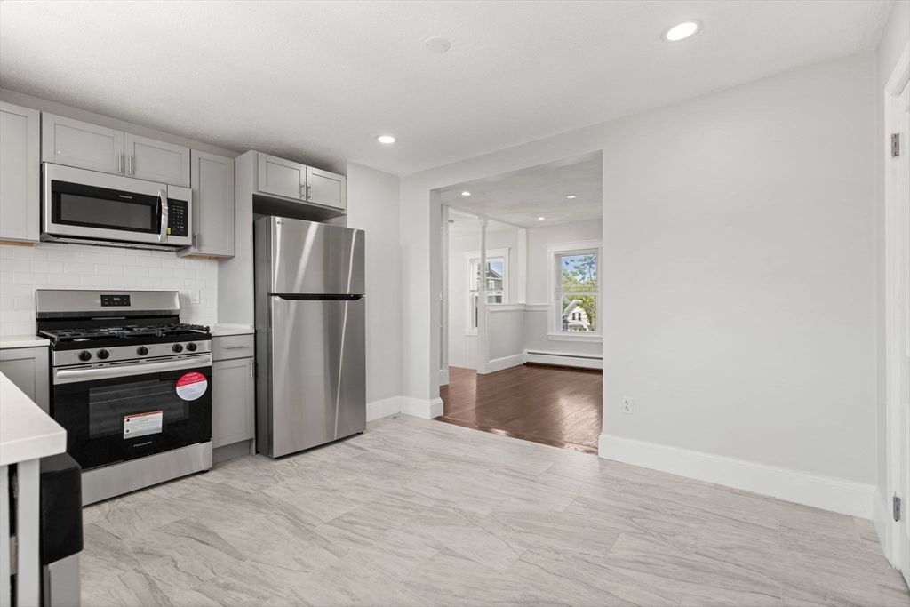 Interior, Kitchen, Marble, Recessed Lighting, Stainless Steel Appliances, Wood Texture Flooring