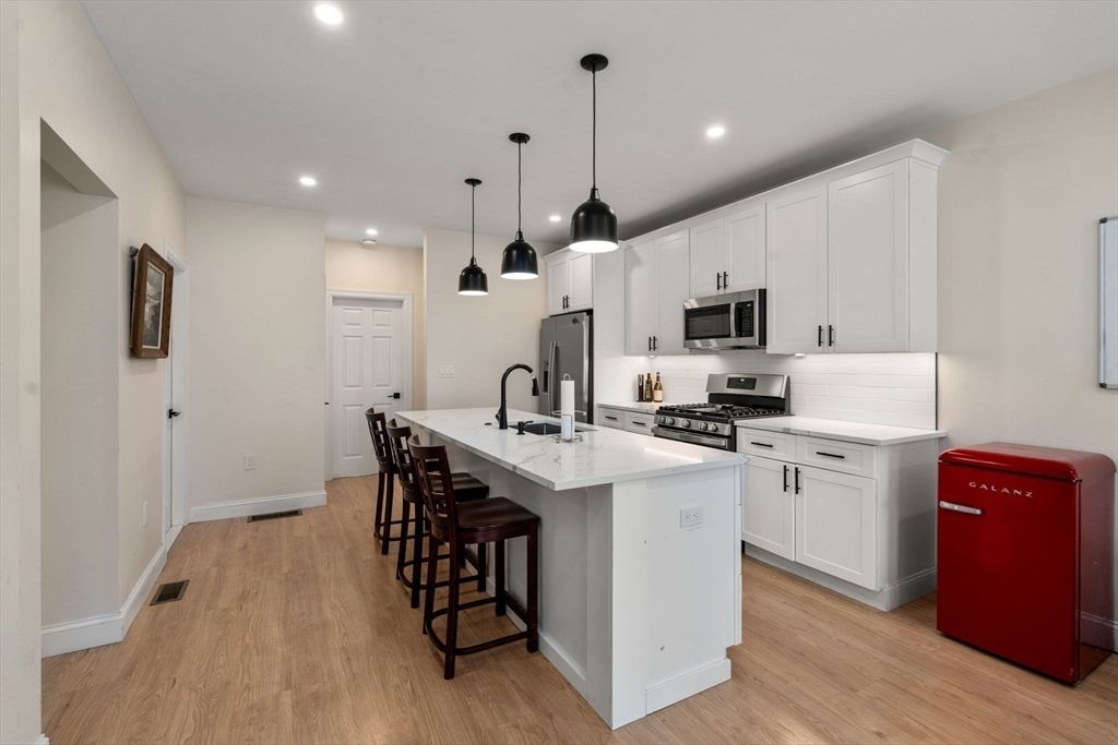 Interior, Kitchen, Pendant Lights, Recessed Lighting, Stainless Steel Appliances, Wood Texture Flooring