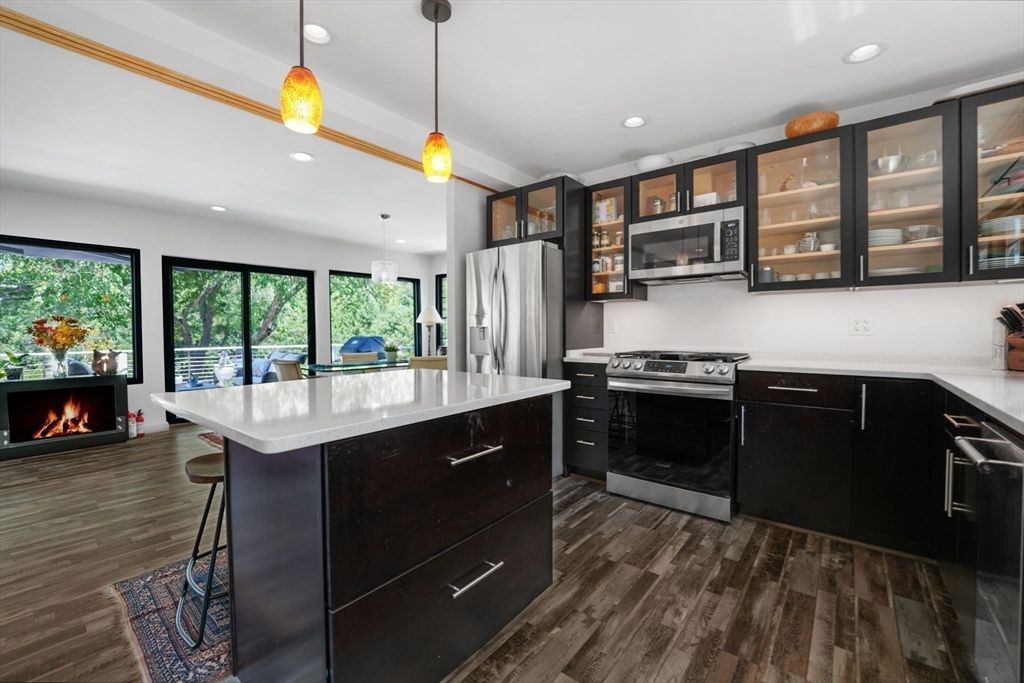 Fireplace, Interior, Kitchen, Pendant Lights, Recessed Lighting, Stainless Steel Appliances, Wood Texture Flooring